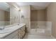 Bathroom with double sink vanity, soaking tub, and neutral decor at 1744 Cum Laude Way, Lawrenceville, GA 30044