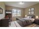 Neutrally decorated bedroom with natural light, modern furniture, and stylish decor at 1744 Cum Laude Way, Lawrenceville, GA 30044