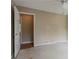 View of the bedroom shows a doorway and window with natural lighting at 1744 Cum Laude Way, Lawrenceville, GA 30044