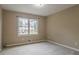 Bedroom features a window with view of the neighborhood at 1744 Cum Laude Way, Lawrenceville, GA 30044