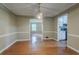 Classic dining area with hardwood floors and modern lighting, flowing into the kitchen at 1744 Cum Laude Way, Lawrenceville, GA 30044