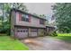 Charming two-story home featuring a two-car garage and nicely landscaped surroundings at 1744 Cum Laude Way, Lawrenceville, GA 30044
