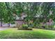 Beautiful home with well-maintained lawn, brick facade, and red shutters at 1744 Cum Laude Way, Lawrenceville, GA 30044