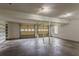 Spacious two car garage with painted walls, concrete floor, and two overhead lights at 1744 Cum Laude Way, Lawrenceville, GA 30044
