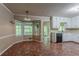 Open kitchen area with a bay window, tile flooring, and ample natural light at 1744 Cum Laude Way, Lawrenceville, GA 30044