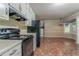 Spacious kitchen area with tile floors and large windows offering natural light at 1744 Cum Laude Way, Lawrenceville, GA 30044