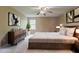 Serene main bedroom with a plush rug, a wooden dresser, and soft, neutral tones at 1744 Cum Laude Way, Lawrenceville, GA 30044