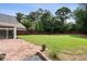 A spacious backyard features a large grassy area, a privacy fence, and a stone patio for outdoor enjoyment at 1860 Leighton Ln, Marietta, GA 30062