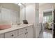 Bathroom with a vanity featuring ample storage and a mirror, creating a bright and functional space at 1860 Leighton Ln, Marietta, GA 30062