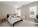Serene bedroom with neutral tones, plush carpet, and large windows for natural light at 1860 Leighton Ln, Marietta, GA 30062