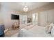 A bedroom featuring a bed, television, and ensuite bathroom offering convenience and comfort at 1860 Leighton Ln, Marietta, GA 30062