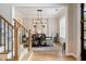 Elegant dining room featuring modern chandelier, stylish furniture, and natural light, creating a refined dining experience at 1860 Leighton Ln, Marietta, GA 30062