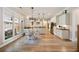Bright kitchen with white cabinetry, stainless steel appliances, and an adjacent breakfast area with a view of the backyard at 1860 Leighton Ln, Marietta, GA 30062