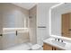 Modern bathroom boasts a glass shower with lights, stylish vanity, and sleek fixtures at 16 Bonnie Ln, Atlanta, GA 30328