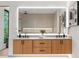 Modern bathroom featuring double vanity, contemporary fixtures, and a large mirror at 16 Bonnie Ln, Atlanta, GA 30328