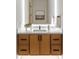 Modern bathroom vanity featuring a white quartz countertop, wood cabinets, and a sleek design at 16 Bonnie Ln, Atlanta, GA 30328