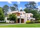 Modern home featuring a geometric design, manicured lawn, and natural wood accents at 16 Bonnie Ln, Atlanta, GA 30328