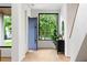 Open foyer showcasing wood floors, modern accents, and abundant natural light through a large window at 16 Bonnie Ln, Atlanta, GA 30328