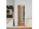 Hallway features natural light, modern painting, and wooden staircase at 16 Bonnie Ln, Atlanta, GA 30328