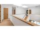 Open, brightly-lit upstairs hallway with modern design, hardwood floors, and skylights at 16 Bonnie Ln, Atlanta, GA 30328