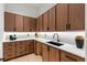 Well-appointed kitchen with wood cabinets, marble countertop, and modern black faucet at 16 Bonnie Ln, Atlanta, GA 30328