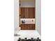 Detailed view of wood cabinetry with a partial view of the kitchen island at 16 Bonnie Ln, Atlanta, GA 30328