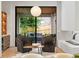 Cozy living room featuring comfortable seating and view of a covered patio at 16 Bonnie Ln, Atlanta, GA 30328