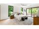 Bright main bedroom with large windows, deck, and modern ceiling fan at 16 Bonnie Ln, Atlanta, GA 30328