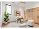 Bright office with neutral colors, modern furniture and decor, a ceiling fan, and a large window at 16 Bonnie Ln, Atlanta, GA 30328