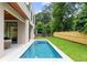 Inviting backyard pool with a modern design, surrounded by a well-maintained lawn and privacy fence at 16 Bonnie Ln, Atlanta, GA 30328