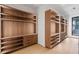 Custom walk-in closet featuring wooden shelving and plenty of storage space at 16 Bonnie Ln, Atlanta, GA 30328