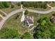 An aerial shot displays the property's well-manicured lawn, patio, retaining wall and spacious driveway at 893 Somersby Dr, Dallas, GA 30157