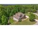Aerial home shot amongst trees, highlighting a large lot and neighborhood curb appeal at 893 Somersby Dr, Dallas, GA 30157