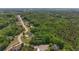 Overhead aerial with property outlined, in relation to vacant lot and other neighborhood homes at 893 Somersby Dr, Dallas, GA 30157