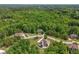 An aerial shot with the neighborhood, showcasing its spacious lots and green surroundings at 893 Somersby Dr, Dallas, GA 30157