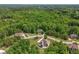 The location of the home in a community with dense forest with winding roads and a private setting at 893 Somersby Dr, Dallas, GA 30157