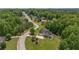 Beautiful aerial shot showcasing the home's setting within a picturesque neighborhood and lush green surroundings at 893 Somersby Dr, Dallas, GA 30157