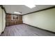 Spacious basement features a wall of cabinets and drawers, and laminate flooring at 893 Somersby Dr, Dallas, GA 30157