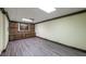 Spacious finished basement with luxury vinyl plank flooring and built-in cabinets at 893 Somersby Dr, Dallas, GA 30157