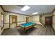 Basement recreation room featuring a pool table and access to the stairway at 893 Somersby Dr, Dallas, GA 30157