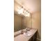 Bathroom featuring a long mirror over a single sink and dark-stained cabinets at 893 Somersby Dr, Dallas, GA 30157