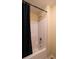 Bathroom with a bathtub and shower featuring a black shower curtain at 893 Somersby Dr, Dallas, GA 30157
