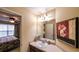 Bathroom with single sink vanity and an art piece hanging on the wall at 893 Somersby Dr, Dallas, GA 30157