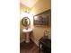 Elegant half bathroom featuring a pedestal sink and decorative accents at 893 Somersby Dr, Dallas, GA 30157
