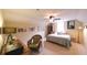 Bedroom with neutral walls, desk area, and a full-sized bed with a gray comforter at 893 Somersby Dr, Dallas, GA 30157