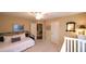 Neutral-toned bedroom with a daybed, carpet flooring and access to another room at 893 Somersby Dr, Dallas, GA 30157