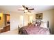 Cozy bedroom with a ceiling fan and access to a bathroom and another room at 893 Somersby Dr, Dallas, GA 30157