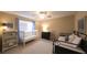 Bedroom featuring a crib, toddler bed, bookcase, and neutral walls and carpet at 893 Somersby Dr, Dallas, GA 30157