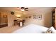 Bright bedroom featuring a ceiling fan, neutral walls, and a cozy work nook at 893 Somersby Dr, Dallas, GA 30157
