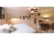Bedroom with neutral carpet, large bed, desk, ceiling fan, and gallery wall at 893 Somersby Dr, Dallas, GA 30157